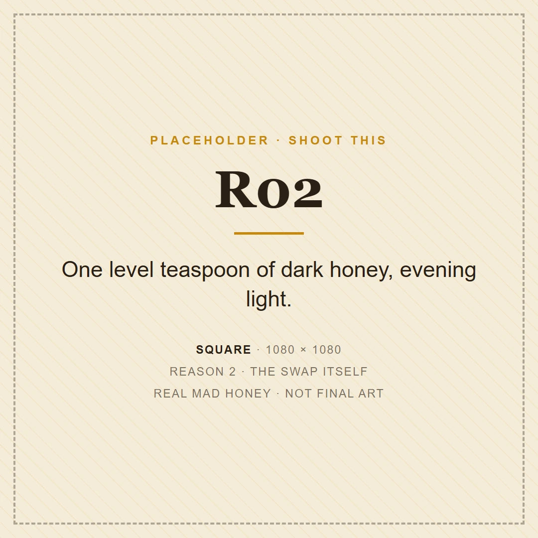 A teaspoon of dark mad honey beside an open jar in evening light