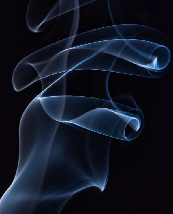 Smoke curling in the dark