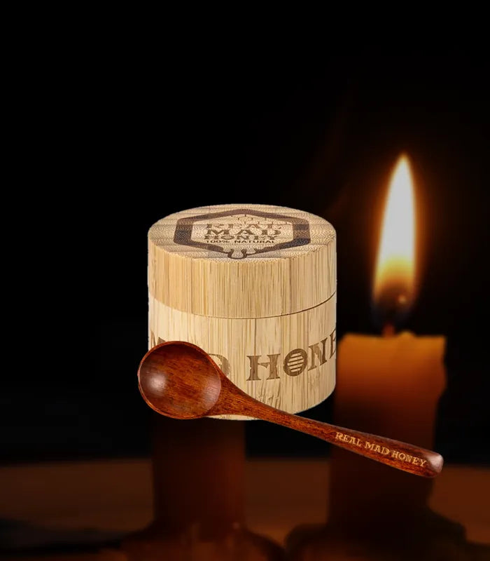 Real Mad Honey bamboo jar with the bamboo honey spoon by candle light