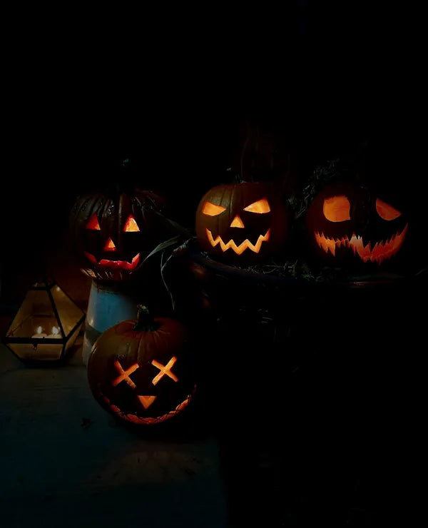 Jack-o-lanterns glowing on a quiet night