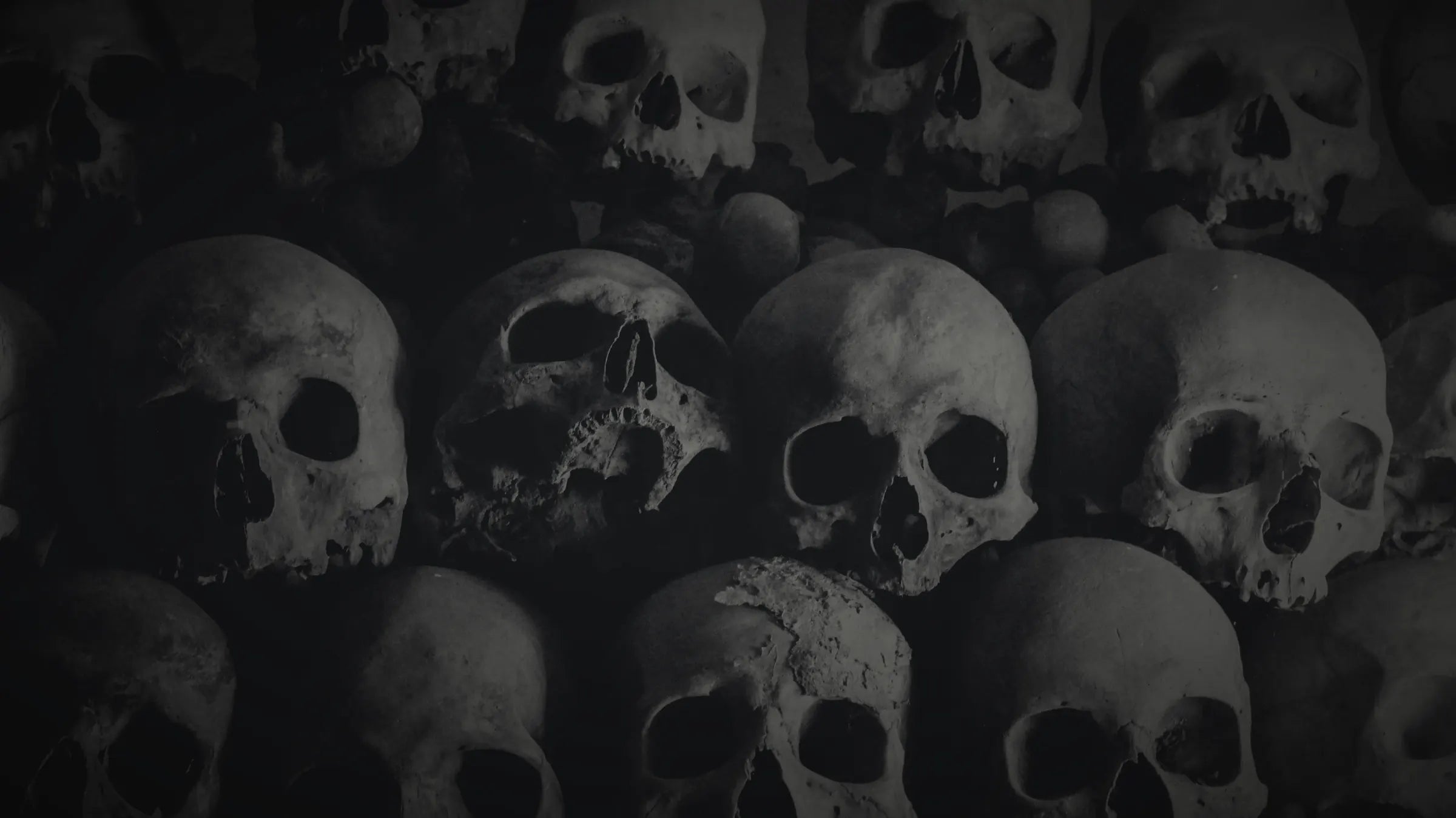 Wall of skulls in the dark